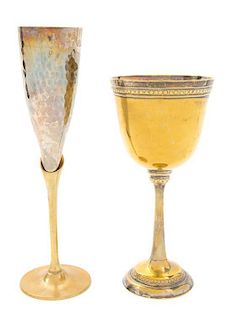An Assembled Set of Brass Stemware Height of champagne flutes 9 5/8 inches.