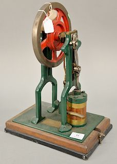 Vertical steam engine with wood lagged cylinder, 7 1/2" flywheel, ht. 16 in., base 12" x 8 1/2", drain in base, green painted cast i...