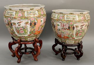 Pair of rose medallion urns. ht. with stands 38 1/2 in., ht. without stands 16 in., dia. 18 1/2 in.