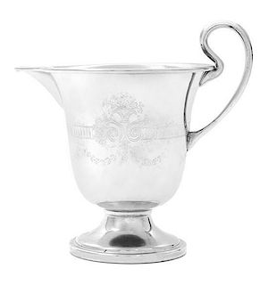 A Silvered-Metal Creamer Height 4 7/8 inches.