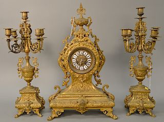Three piece brass clock set with candelabra. clock ht. 21 in.