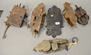 Group of six early iron and metal locks, some with keys and incised design. ht. 9 1/2 in. to 17 in.