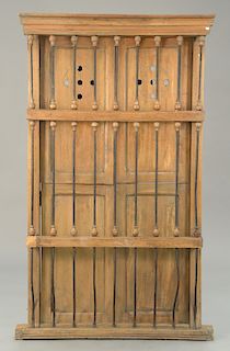Continental shutters behind bars, probably 19th century. ht. 76 in., wd. 44 in.