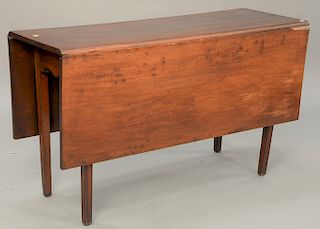 Federal cherry drop leaf table, circa 1800. ht. 27 1/2 in., top open: 48" x 50"