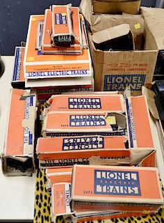Full Lionel train set in original boxes to include two engines, coal car, nine cares, train tracks, trainmaster transformer and mult...