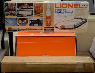 Lionel train group in original boxes to include Lionel Bascule Bridge 313, Hopper car with coal ramp kit, and a Santa fe Double dies...