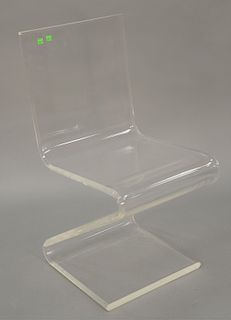Lucite Z form dining side chair and ladder style curio. 