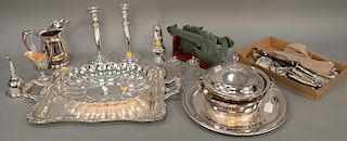 Group of sterling to include serving spoons, candlesticks, cuttery and castor; plus silver plated lot with a tray and a pair of hard...