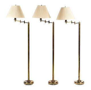 Three Brass Swing Arm Floor Lamps Height overall 61 inches.