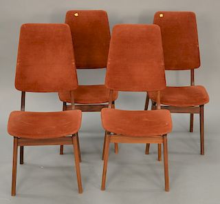 Four teak Kofod Larsen dining chairs.