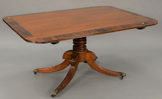 Mahogany breakfast tip table with rose wood banded top (cracking in banding). ht. 27 in., top: 40" x 58"