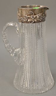 Cut glass pitcher with sterling silver top (chipped). ht. 12 in.