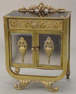 Brass cabinet with glass panel inserts, black top, front and sides patterned glass (crack in front door). ht. 25 in., wd. 20 1/2 in.