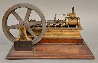 Early horizontal brass one cylinder steam engine with iron 8 1/2'' flywheel, lg. 16 in.