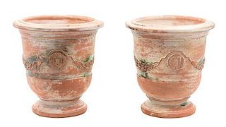 A Pair of Terra Cotta Urns Height 9 1/4 inches.