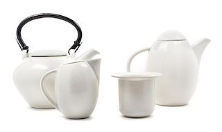 A Collection of Ceramic Teapots Width of first over handle 12 inches.