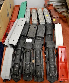 Four Lionel train sets with four engines and sixteen cars.