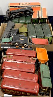 Three sets of Lionel trains, red passenger cars, two sets of green passenger cars, three with original boxes.