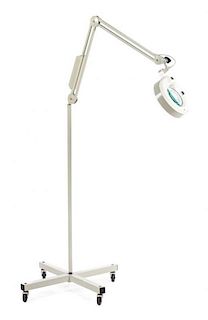 A Luxo Floor Lamp and Magnifier Height 65 5/8 inches.