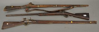 Three long rifles including two flintlock and one black powder Rolling Block (as is, rust), lg. 49 3/4'' - 52 1/2''
