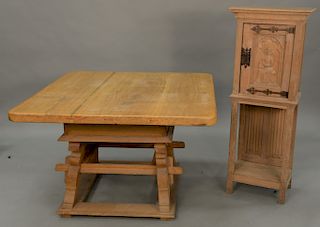 Two piece lot to include square oak table with slide top (ht. 29 in. top: 45" x 47") and a one door cabinet having carved figure on ...