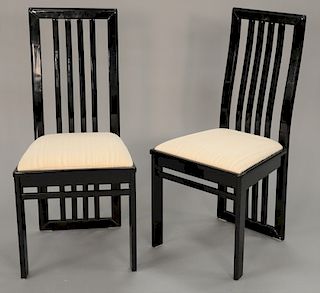 Six black lacquered Italian dining chairs.