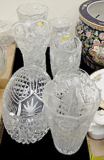 Eight cut glass pieces to include seven cut glass vases (ht. 7 1/4 in. to 11 3/4 in.), and a large center flower bowl.