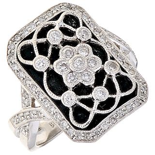 A diamond and enamel 14K white gold ring.