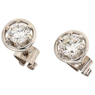 A diamond 18K white gold pair of stud earrings.