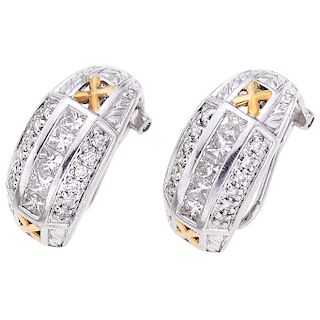 A diamond platinum and 18K yellow gold pair of earrings.