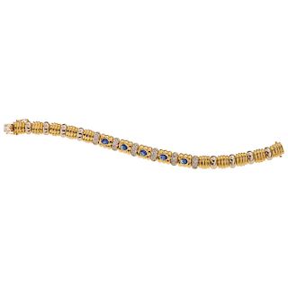 A sapphire and diamond 18K yellow gold bracelet.