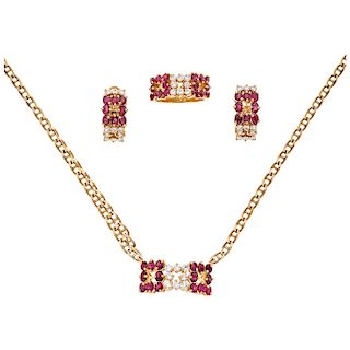 A ruby and diamond 18K and 14K yellow gold choker, ring and pair of earrings set.