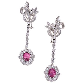 A ruby and diamond palladium silver pair of earrings.