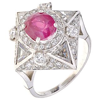 A ruby and diamond platinum ring.