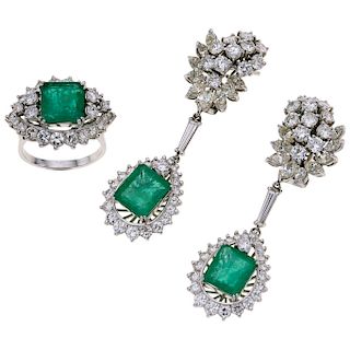 An emerald and diamond platinum and palladium silver ring and pair of earrings set.