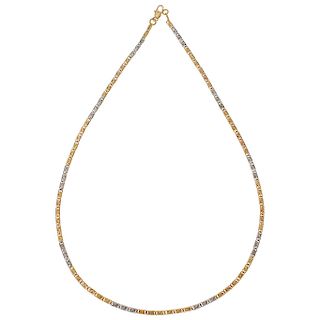 An 18K yellow, white and rose gold necklace.