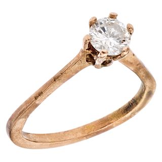 A diamond 10K yellow gold solitaire ring.
