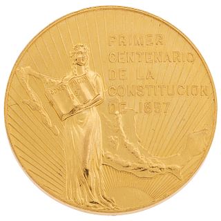 A 21.6K yellow gold medal.