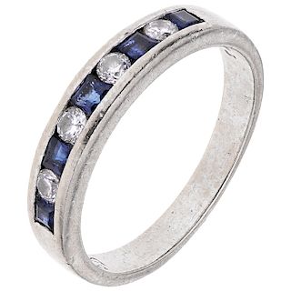 A diamond and sapphire 18K white gold ring.