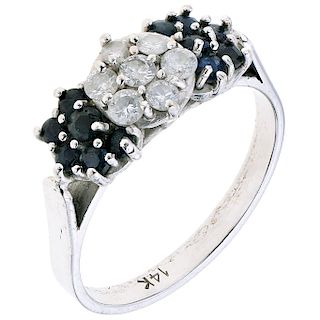 A diamond and sapphire 14K white gold ring.