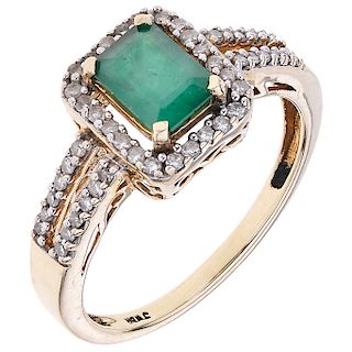 An emerald and diamond 10K yellow gold ring.