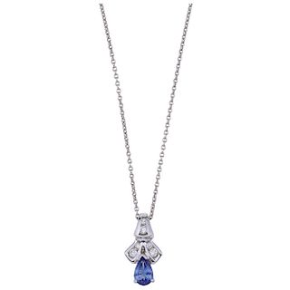 An 18K white gold necklace and 14K white gold tanzanite and diamond pendant.