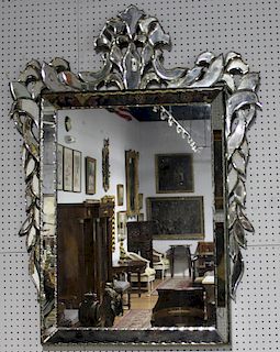 A Large Venetian Style Mirror.
