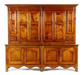 A Louis XV Provincial Walnut Meuble a Deux Corps Height 99 3/8 x width 108 1/4 x depth 21 1/4 inches.
