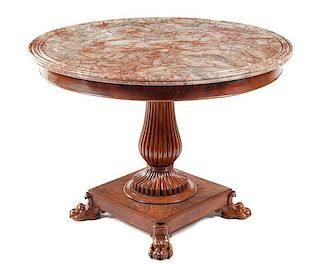 A Charles X Mahogany Center Table Height 30 1/2 x diameter of top 41 inches.