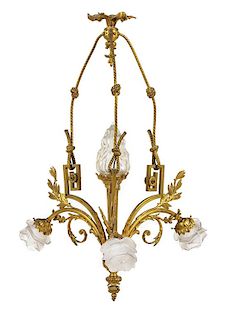* A French Gilt Bronze Four-Light Chandelier Height 35 x width 20 1/4 inches.