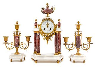 A French Gilt Metal Mounted Marble Clock Garniture Height of mantel clock 16 1/2 inches.