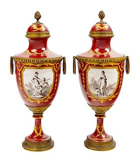 A Pair of French Gilt Metal Mounted Porcelain Urns Height 17 1/8 inches.