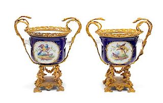A Pair of Sevres Style Gilt Bronze Mounted Cache Pots Height 15 1/4 inches.