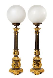 A Pair of French Gilt and Patinated Bronze Fluid Lamps Height overall 35 1/2 inches.